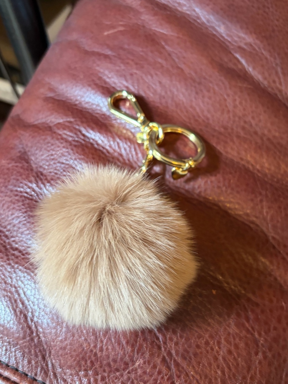 Michael Kors Tan Pom Pom Keychain with Gold Hardware